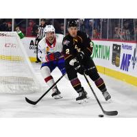 Cleveland Monsters defenseman Adam Clendening (right) vs. the Laval Rocket