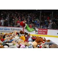 Vancouver Giants in Teddy Bear Toss jersey dive into a bile of bears