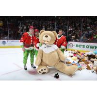 Vancouver Giants pose with a giant teddy bear
