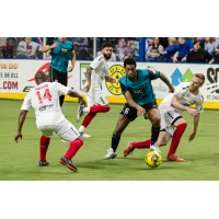 Leo Gibson of the Kansas City Comets (left) eyes the ball against the St. Louis Ambush